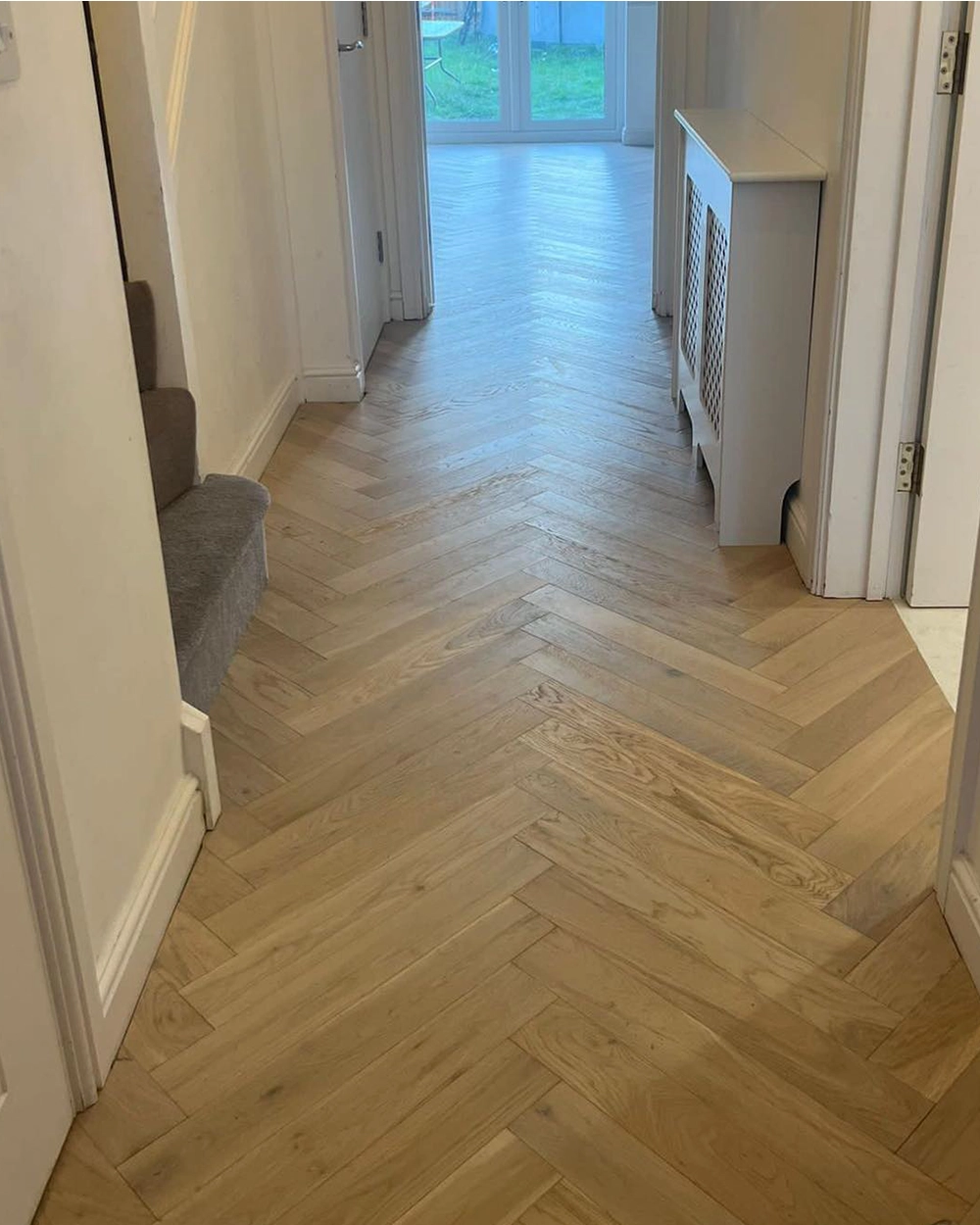 Oak flooring being installed by LJB Carpentry in a Kent home