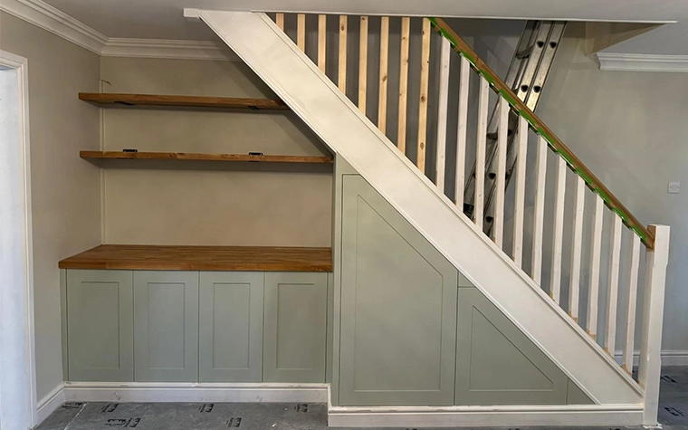 Built-in alcove cabinets and media wall by LJB Carpentry in Kent