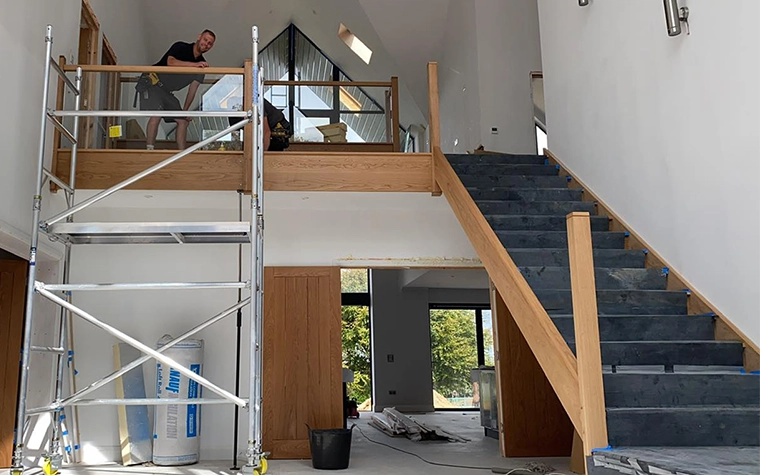 Open-tread solid oak staircase built by LJB Carpentry in Kent